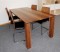 Tisch Mode...Tisch in Nussbaum massiv, DD-antikmatt lackiert, 
Zierplatten in chromstahl poliert. Mit 50 cm Verlngerung erhltlich